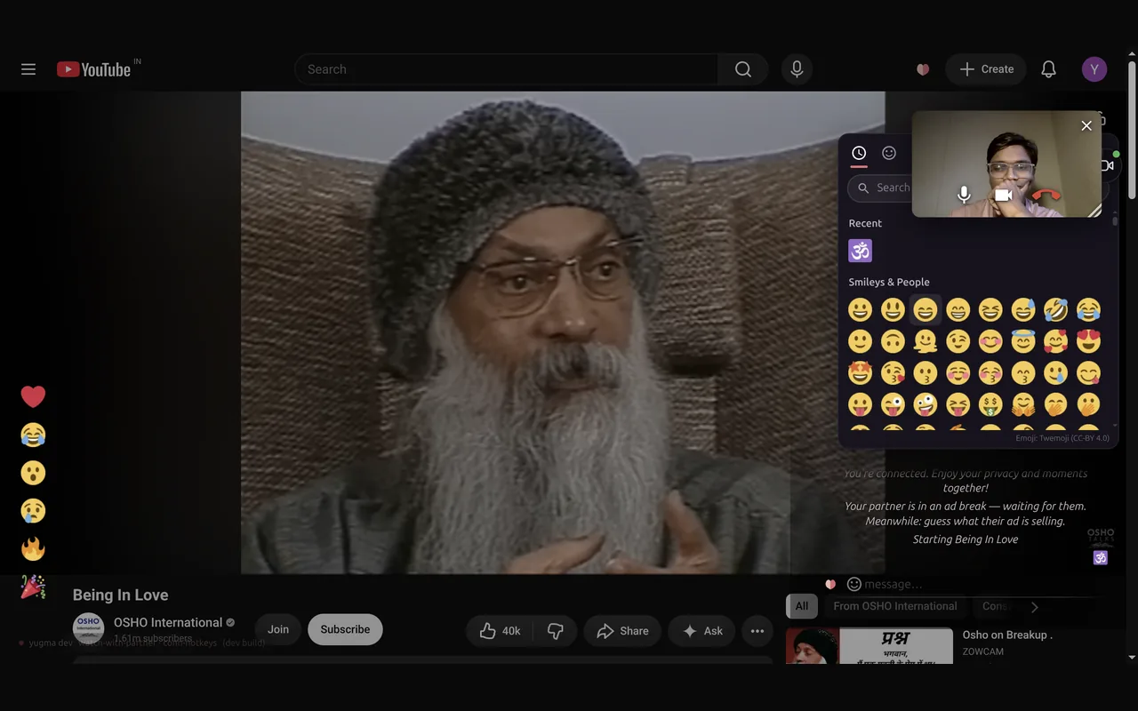 A YouTube talk playing with Yugma on top: a video call with the partner in the corner, the emoji picker open, emoji reactions down the side and partner messages in the chat.